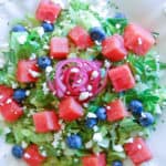 summer watermelon salad: chopped romaine, blueberries, diced watermelon, pickled red onions, and crumbled feta