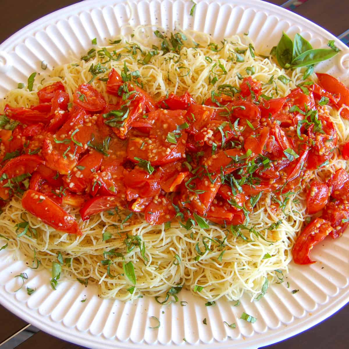 tomato confit over angel hair pasta with fresh basil