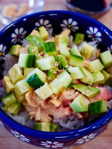 spicy california sushi bowl with sticky rice, spicy surimi, diced cucumber and avocado